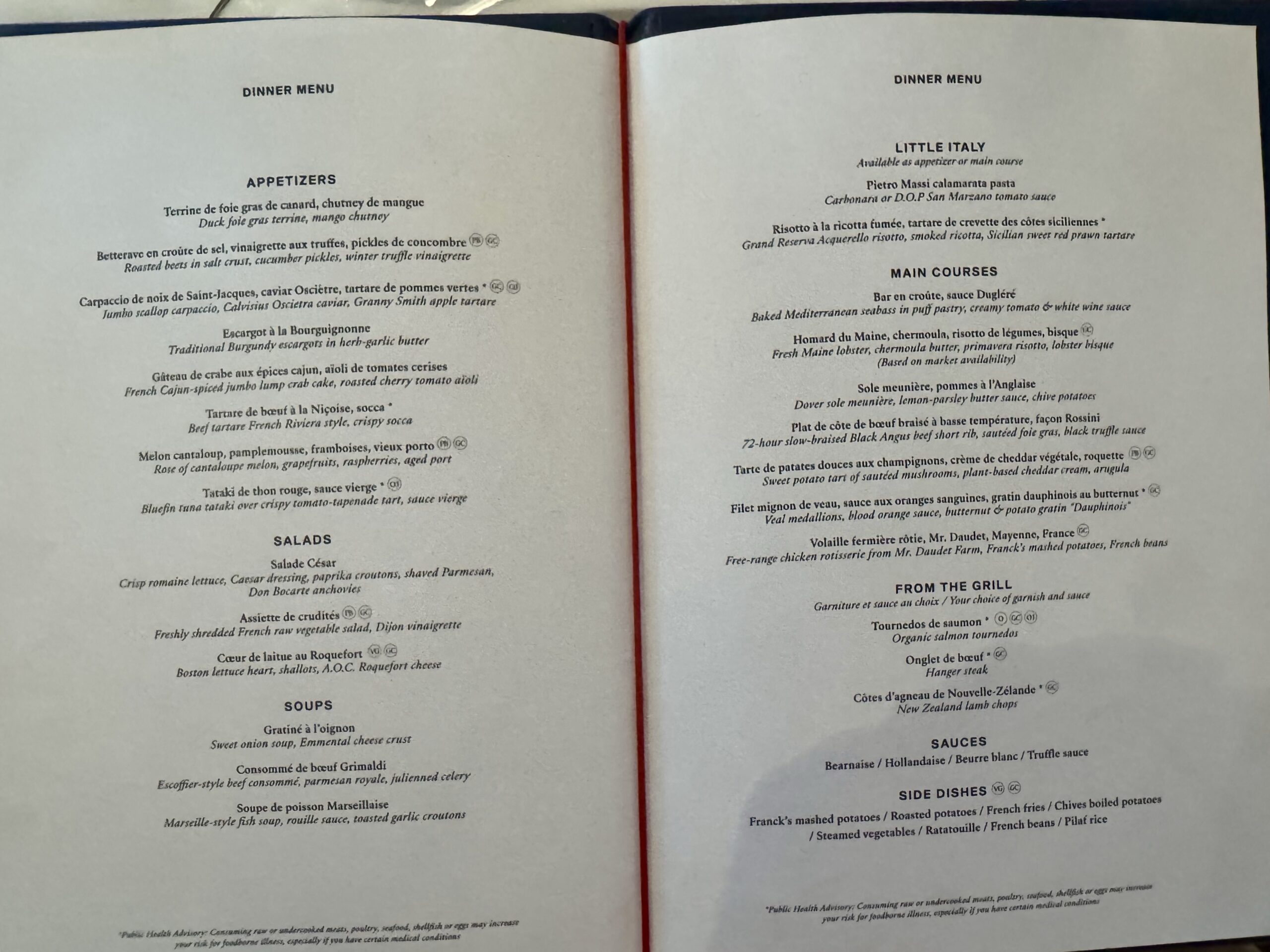 Open two-page dinner menu with Appetizers and Salads on the left and Little Italy and Main Courses on the right, bound by a red spine.